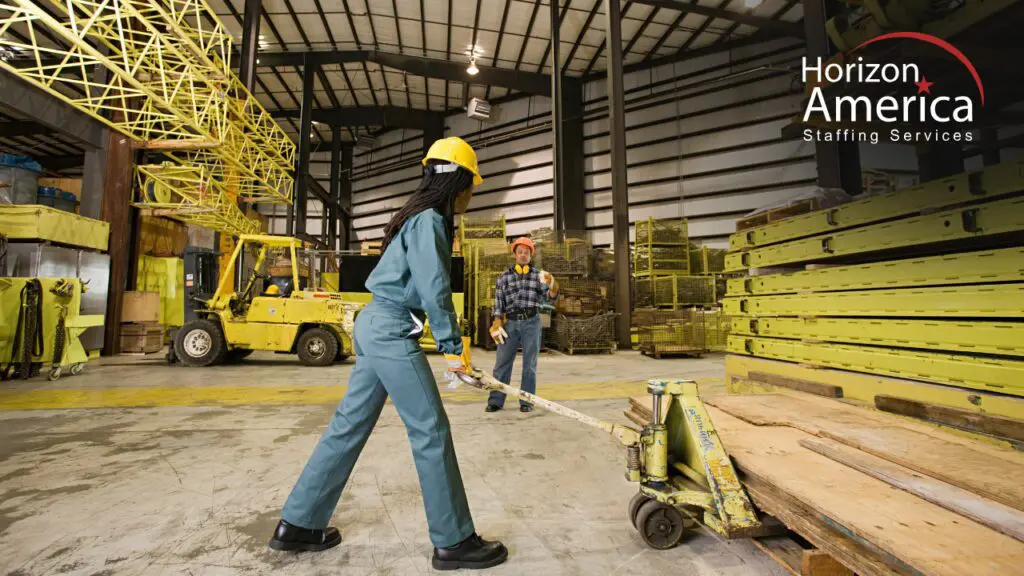 Workers handling materials and equipment in a warehouse facility