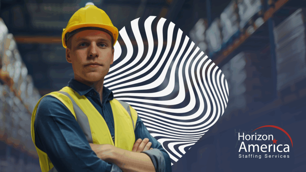 Industrial worker in safety vest and hard hat stands confidently with arms crossed