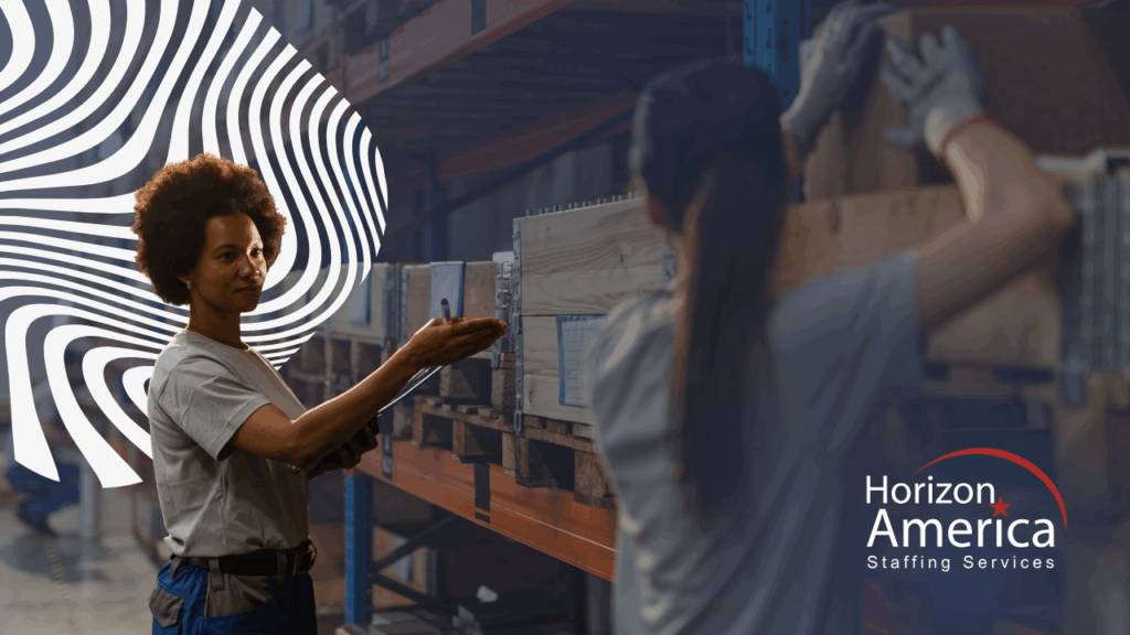 Light industrial workers discuss work in a warehouse.