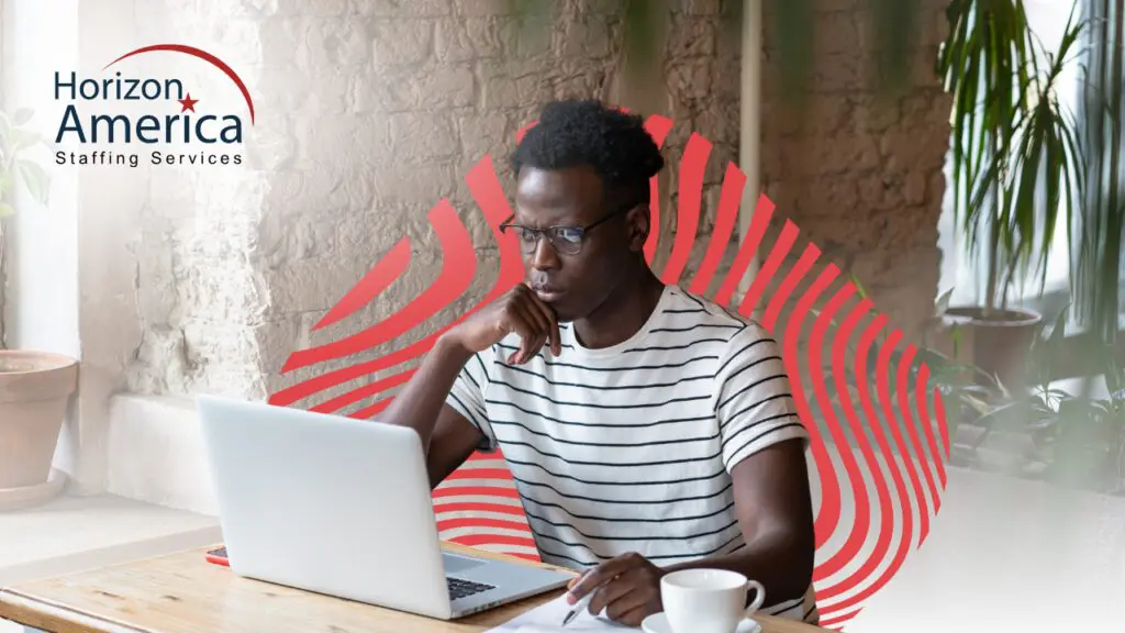 An interested applicant browses the internet for food processing job opportunities on a laptop.