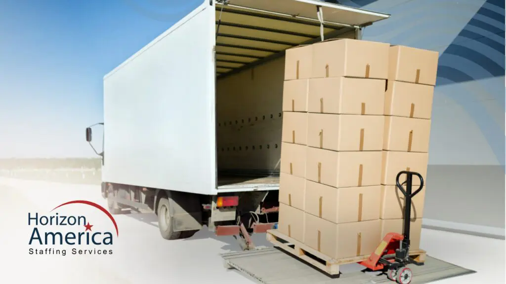 Stacked cardboard boxes on a pallet being loaded into a delivery truck at a distribution facility, illustrating logistics staffing gaps and the need for flexible warehouse labor.