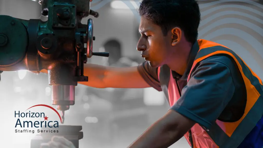 A light industry employee works with machinery, symbolizing on-the-job training and skill development