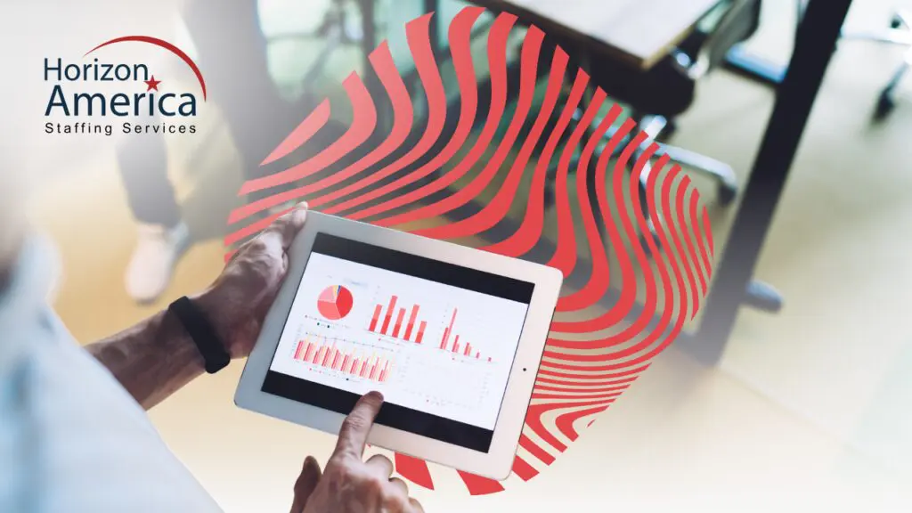 Light industrial manager views workforce analytics on a tablet