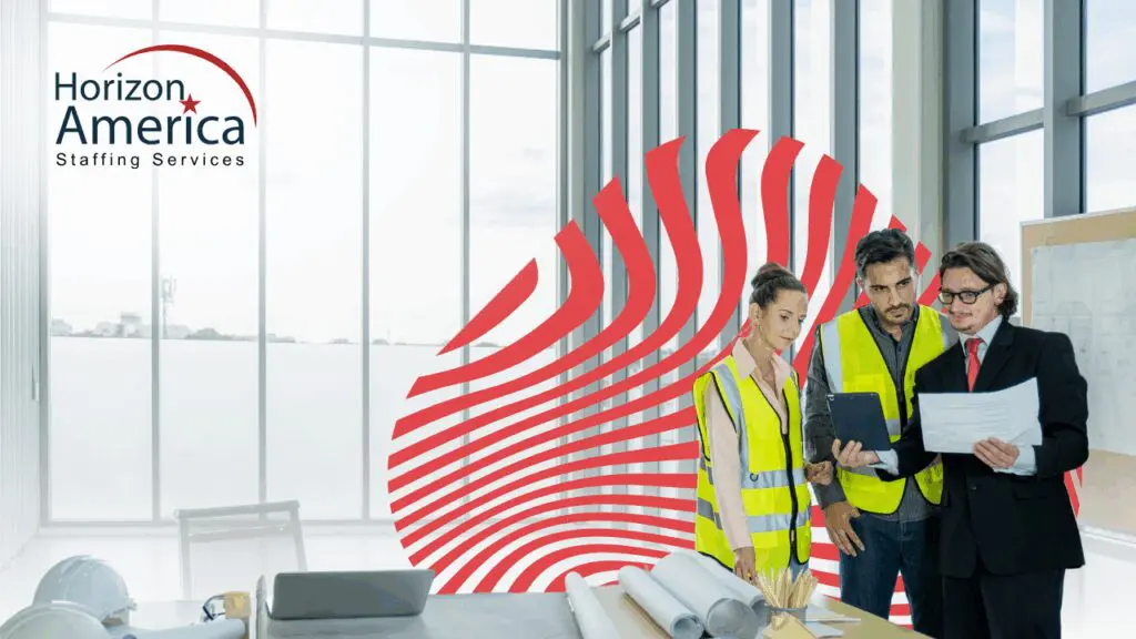 A light industry leader in a coat and tie discussing operations with two light industrial staff in safety vests, reflecting a staffing partnership.