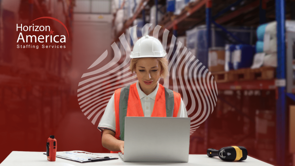 Female industrial worker using a laptop